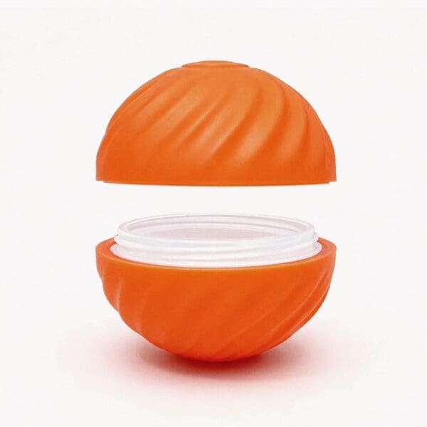 The SmartPawz PawMinder interactive toy disassembled, showing the core and the outer shell, which can be easily replaced.