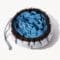 The SmartPawz snuffle mat cinched into a small bowl shape, an ideal size for hiding treats and providing a mental workout for small dogs.